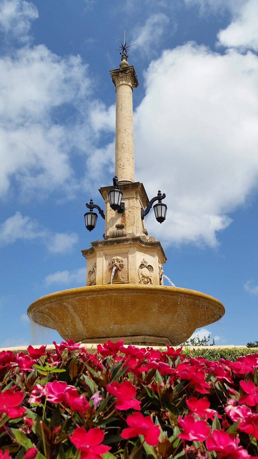 Coral Gables De Soto Fountain. Adorned with colorful flowers and small shrubs, the De Soto Fountain really is a simple yet elegant backdrop to your photos.