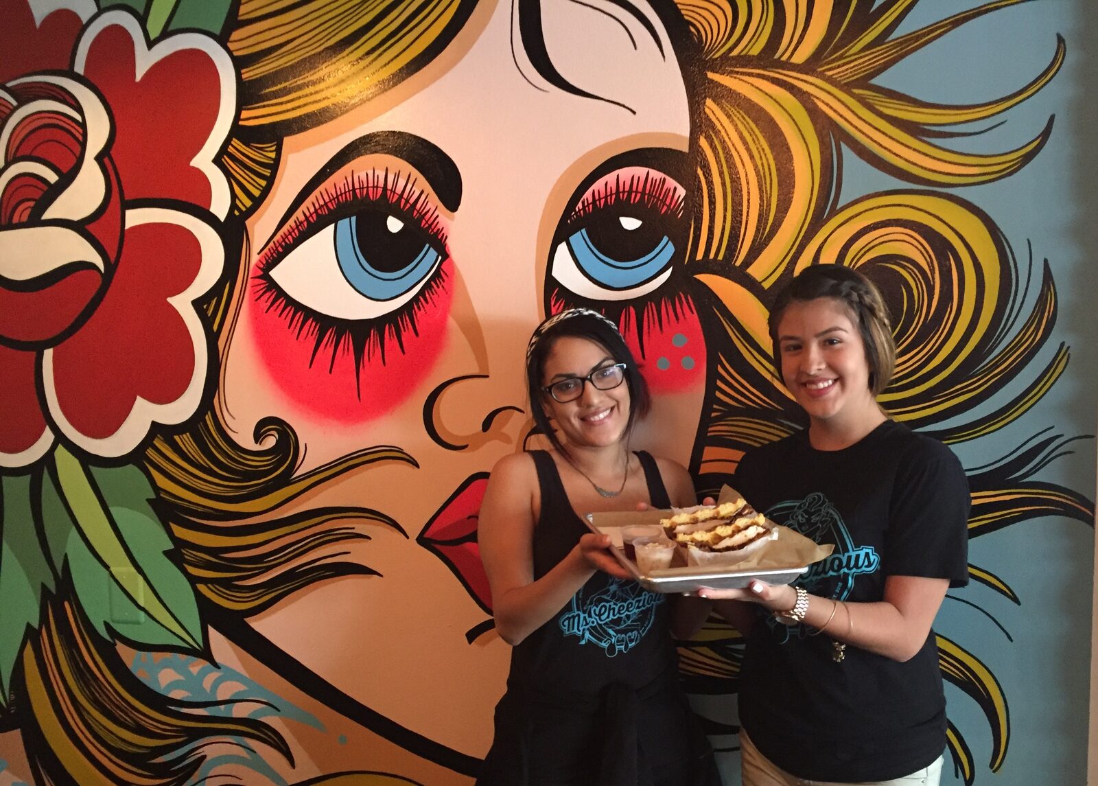 Jessenia and Destiny Serving the Southern Fried Chicken and Waffle