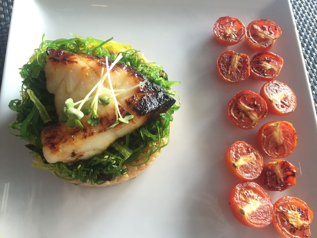 Miso Yaki Seabass with roasted tomatoes from Sushi Maki in Coral Gables. Click to read more or Pin and save for later.